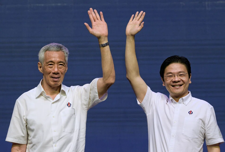 PM Lee Hsien Loong (left) affirms his confidence in DPM Lawrence Wong and the 4G leaders in his National Day Rally address.