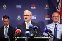 Australian Prime Minister Anthony Albanese (centre) during a visit to the NSW Police headquarters, Sydney, Australia, Dec 16, 2025.