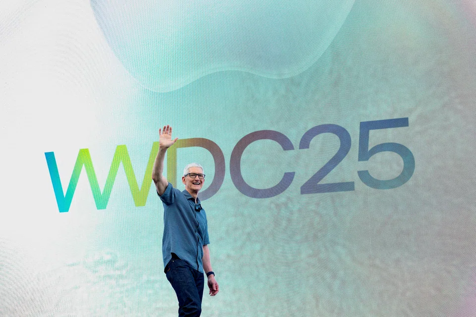 Apple CEO Tim Cook waves during Apple's annual World Wide Developers Conference at the company's headquarters in Cupertino, California, June 9, 2025.  