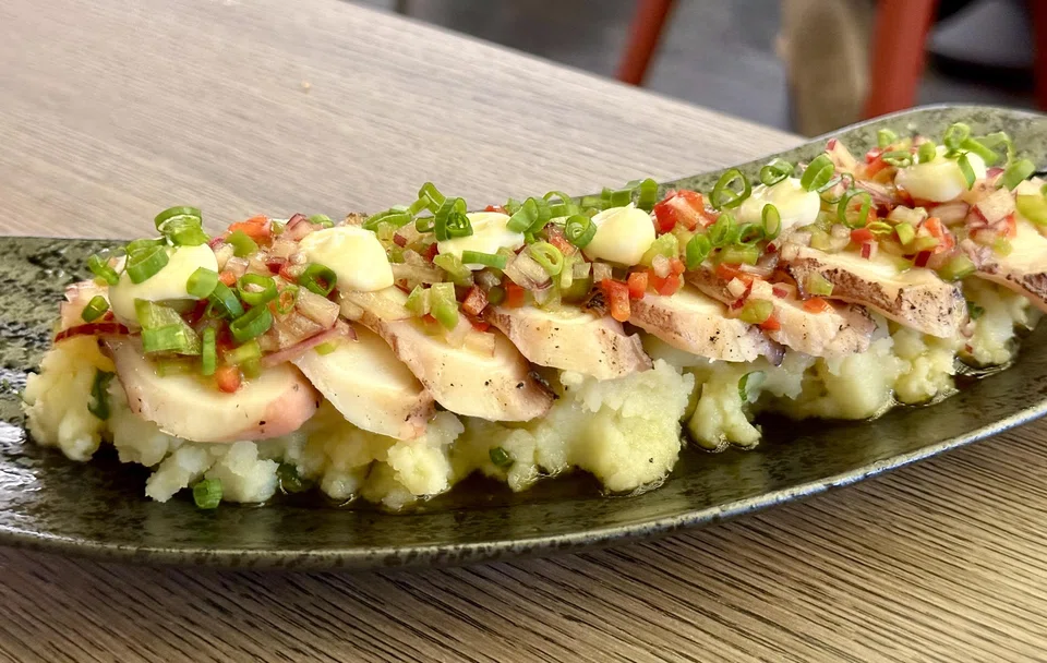 Octopus and potatoes dressed in shishito vinaigrette.