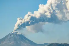 Mount Lewotobi Laki Laki spews ash and smoke during an eruption as seen from Lewolaga village in Titihena, East Nusa Tenggara, Indonesia, Nov 13, 2024. 