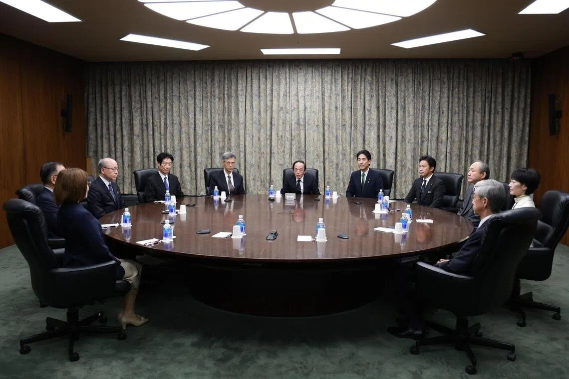 Bank of Japan governor Kazuo Ueda (centre) at a monetary policy meeting with members of the policy board and government officials at the central bank's headquarters in Tokyo, Japan, Oct 30, 2025. 