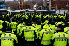Police stand guard, blocking the road leading to the official residence of impeached South Korean President Yoon Suk Yeol as protesters gather nearby, Seoul, South Korea, Jan 5, 2025.