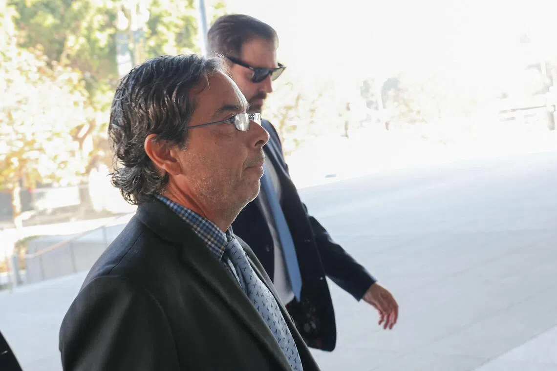 Former medical doctor Mark Chavez (front) arrive for his sentencing at the United States District Court in Los Angeles, California, Dec 16, 2025. 