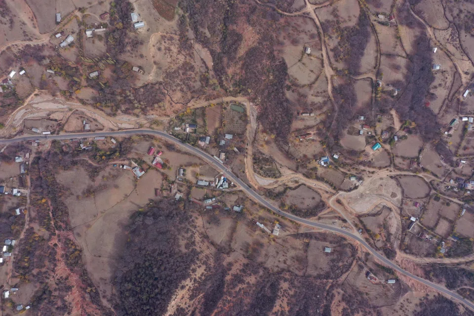 Above: an aerial view of the thinning walnut forest in Aslanbap. It is the world's largest wild walnut grove.