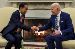 US President Joe Biden shakes hands with Indonesian President Joko Widodo during a meeting for talks on regional security and clean-energy transition, among other things, in the Oval Office at the White House in Washington, US, Nov 13, 2023. 