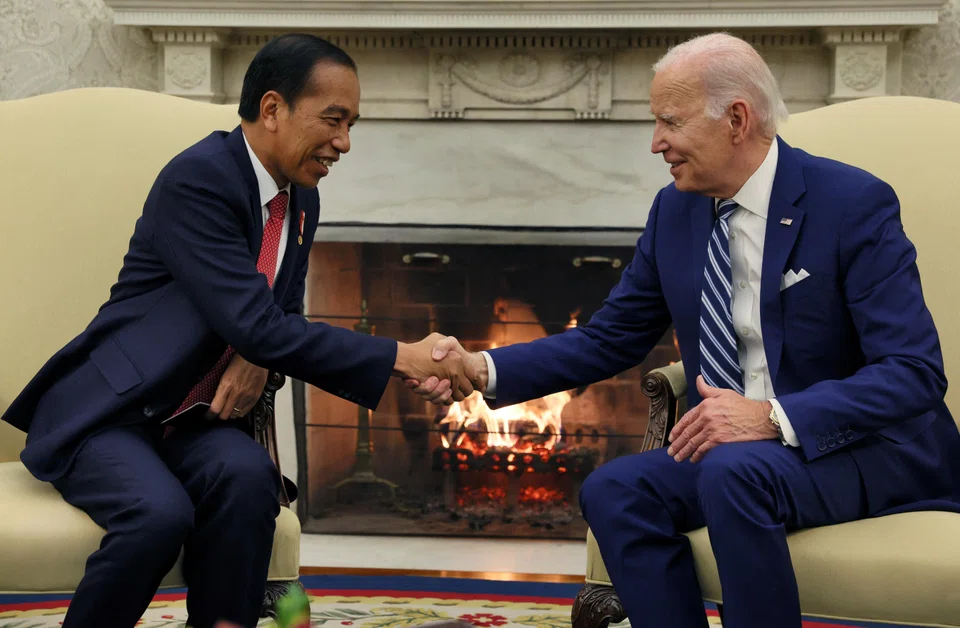 US President Joe Biden shakes hands with Indonesian President Joko Widodo during a meeting for talks on regional security and clean-energy transition, among other things, in the Oval Office at the White House in Washington, US, Nov 13, 2023. 