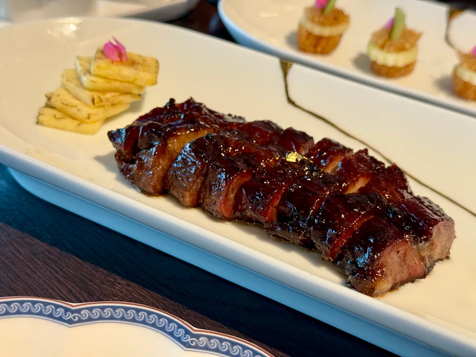 Iberico char siew paired with pineapple slices.