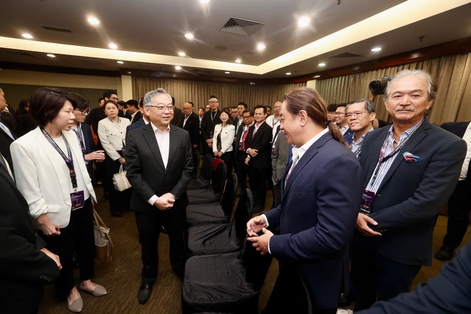 Singapore's Deputy Prime Minister and Minister for Trade and Industry Gan Kim Yong (second from left) meeting with business and government leaders on Monday (Apr 21).   