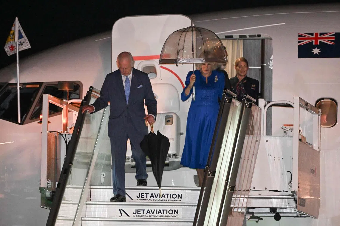 Britain's King Charles III and Queen Camilla exit their plane after arriving at Sydney International Airport in Sydney for a nine-day tour of his far-flung Australian and Samoan realms.