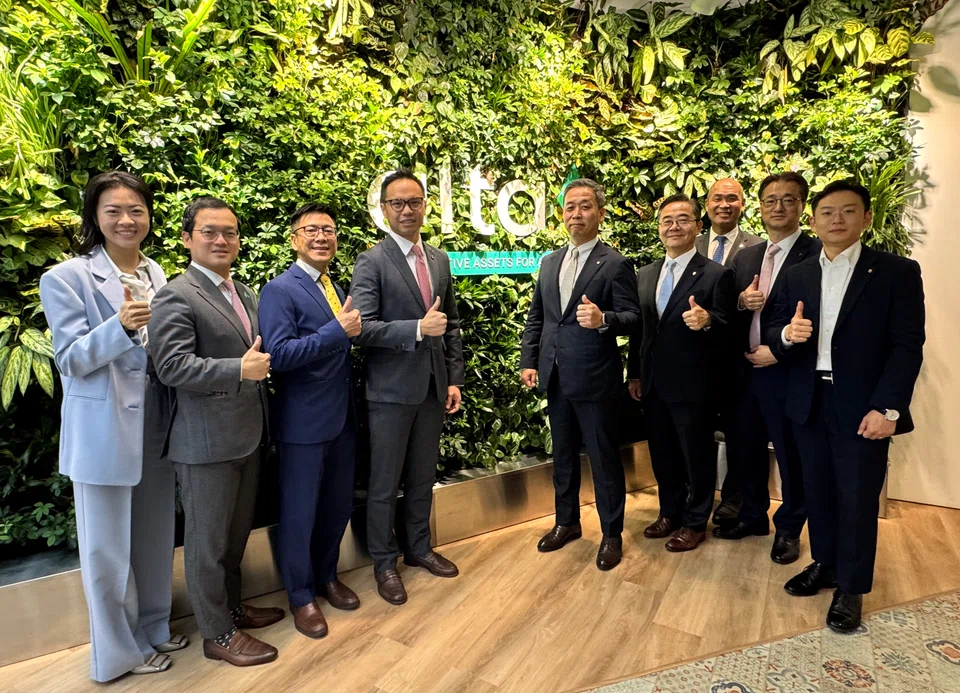 Representatives from Alta Group and NH Investment & Securities pose for a group photo following the signing of the MoU.