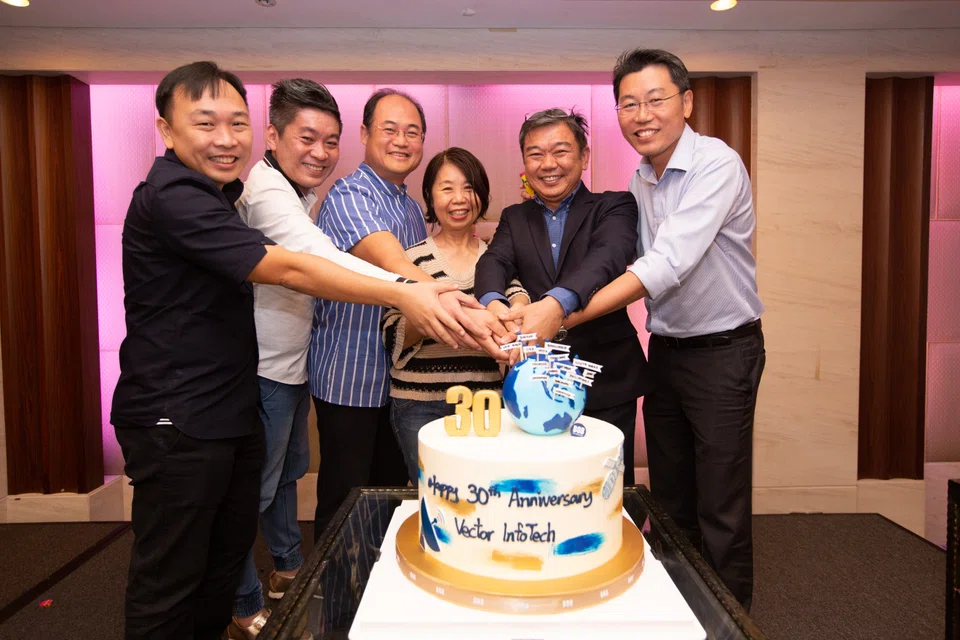 Vector InfoTech's management celebrating the company's 30th anniversary. From left: Managing director Francis Lau, regional products sales director Lai Yew Yeow, deputy chief executive officer Hii Ding Sin, chief operating officer and chief financial officer Lynn Lau, chief executive officer Lau Kok Hui, and managing director of subsidiary Vector Green, Ben Teng.