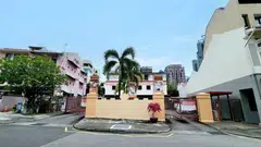 The site is currently occupied by a pair of three-storey semi-detached houses and a childcare centre.