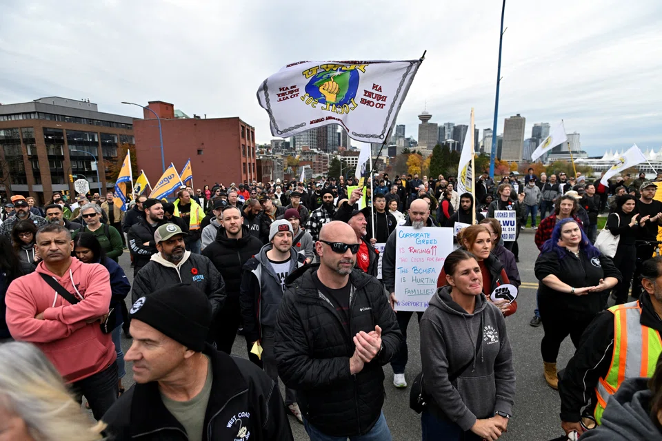 International Longshore and Warehouse Union Local 514 members and supporters gather outside of the Port of Vancouver amid a labour dispute in Vancouver, Canada.