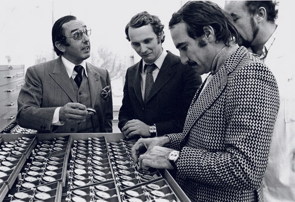 An archival photo of Jack Heuer (left) with F1 drivers Nicky Lauda (middle) and Clay Reggazoni (right) from the 1970s.