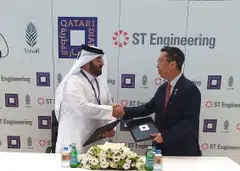 Qatari Diar's chief executive Ali Mohamed Al-Ali (left) and ST Engineering's president of urban solutions Chew Men Leong at the contract signing in Qatar. 