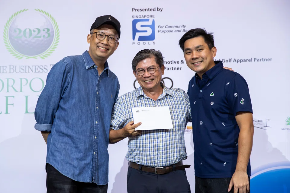 Team Centurion's Stanley Gan (centre) was the overall individual winner of the third leg of The BT Corporate Golf League on Mar 24. With him are SPH Media's Lim Han Ming (left) and Adidas Golf's Ken Sim.