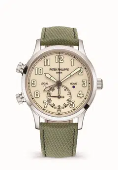 The new Patek Philippe Calatrava Pilot Travel Time 5524G-010 boasts an elegant vintage-style ivory lacquered dial, as well as a khaki green composite-material strap with fabric pattern.  