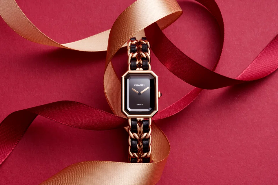 Première Édition Originale watch in steel coated with yellow gold, black leather, black-lacquered dial and high precision quartz movement (S$8,850)                                  