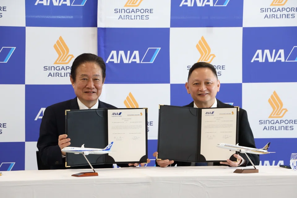 ANA chief executive Shinichi Inoue (left) and his SIA counterpart Goh Choon Phong. The JV will enable the airlines to better coordinate flight schedules between Singapore and Japan, and improve connectivity between the carriers.