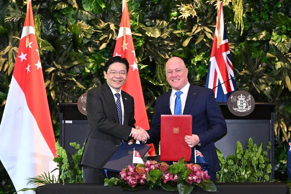 Prime Minister Lawrence Wong (left) and Prime Minister of New Zealand Christopher Luxon signing the Singapore - New Zealand CSP at The Pavilion, Government House Auckland in New Zealand on Oct 10.