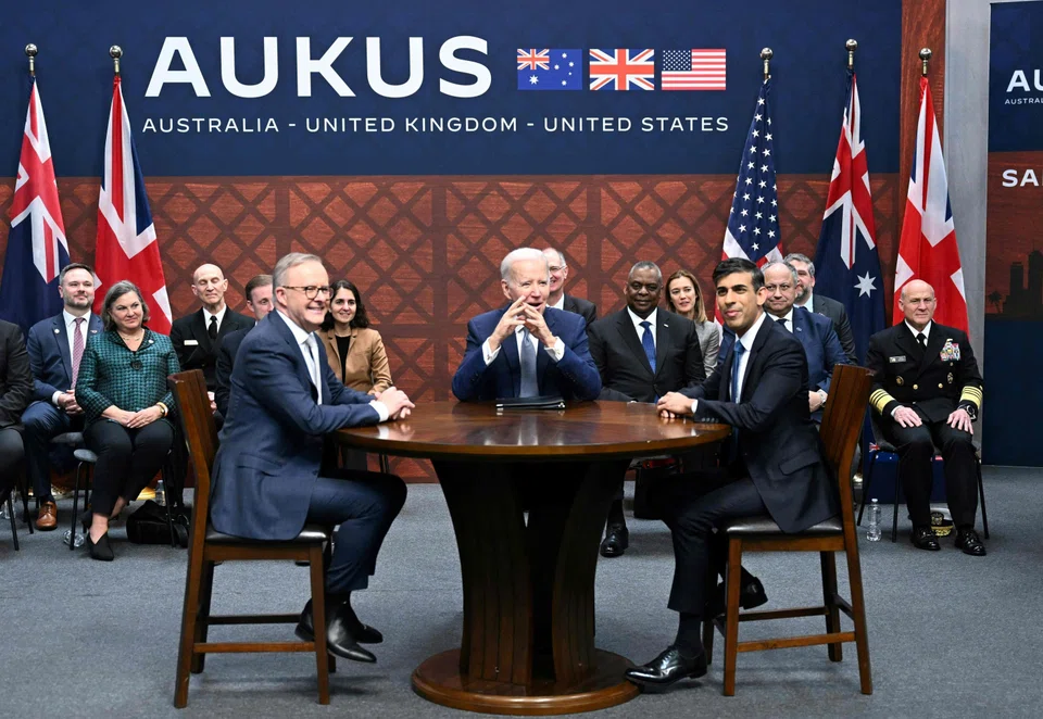 US President Joe Biden (centre) with British Prime Minister Rishi Sunak (right) and Australia's Prime Minister Anthony Albanese during the Aukus summit on Mar 13; after 18 months of negotiations, US and UK leaders last week announced details of their plan to provide a fleet of nuclear-powered submarines to Australia over 30 years. 