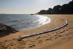 An oil absorbing boom has been deployed at the East Coast beach. 