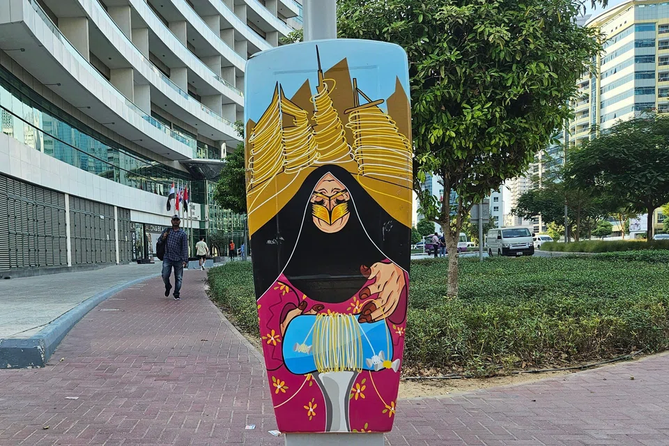 A drawing of an Emirati woman practising Al Talli, a traditional local embroidery technique, is painted on a parking metre in Dubai. With the relentless pace of change in the United Arab Emirates, its days may be numbered.