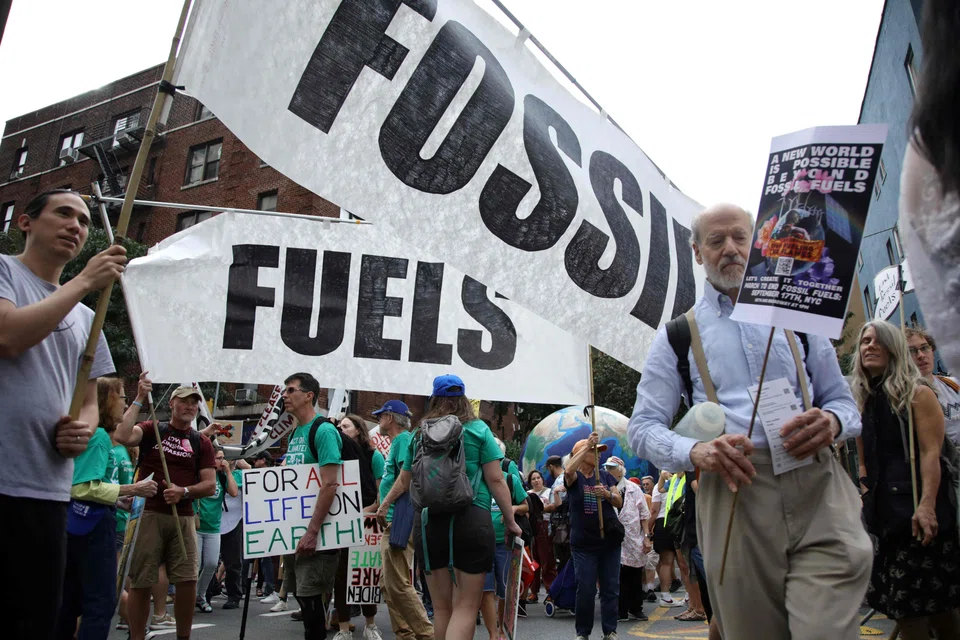 People rally to end fossil fuels ahead of the 78th United Nations General Assembly and Climate Ambition Summit in New York on Sept 17, 2023. 