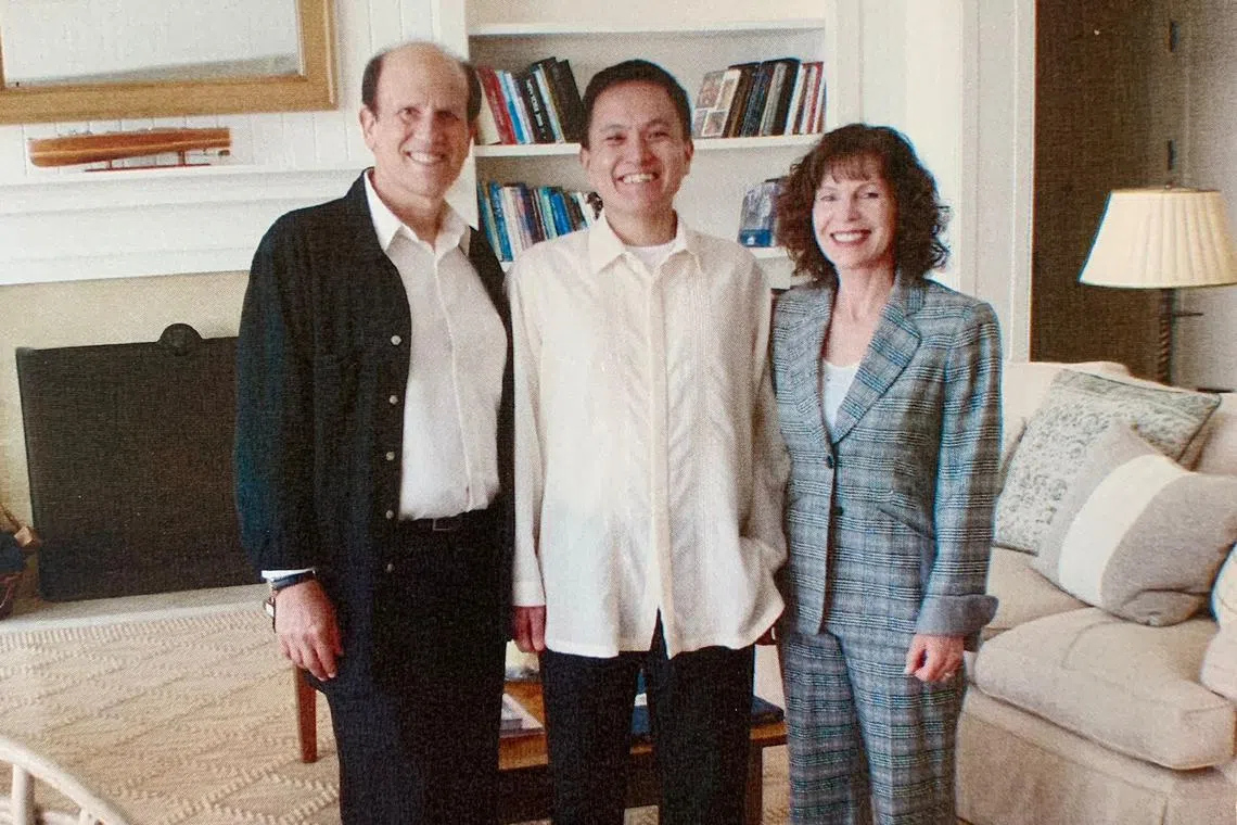 Writer Tan Chin Hwee (middle) with Mike Milken and his wife Lori at their home in California, in 2015