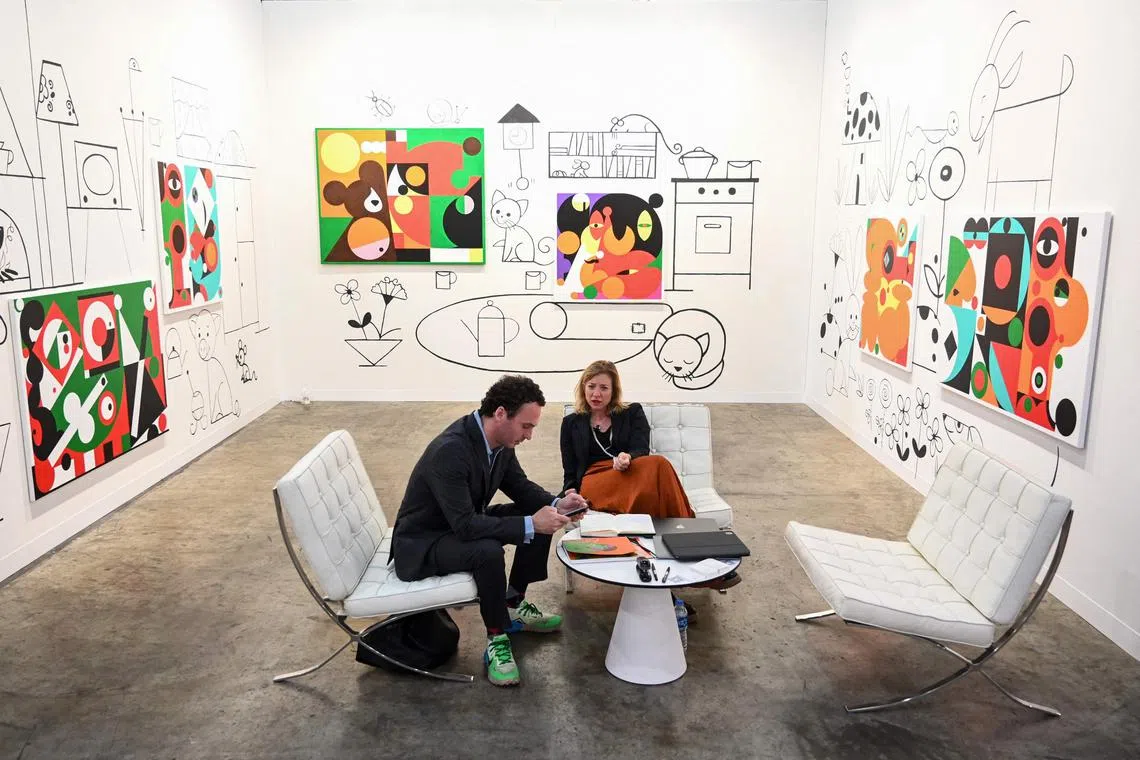 Gallerists manning one of the over 170 booths at Art Basel Hong Kong selling modern and contemporary art.