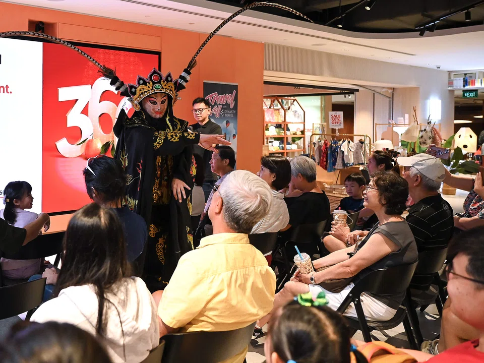 A mask-changing or bian lian performance at Dynasty Travel's Blink fair. The tour agency is seeking to combine good deals with cultural appreciation.