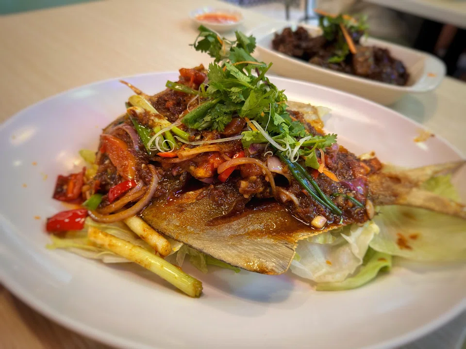 Deep-fried pomfret in a tangy sambal sauce.