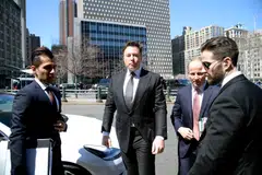 According to media reports on Saturday, Elon Musk (centre) fired top executives in an effort to avoid hefty severance payouts, while lining up other layoffs as soon as Saturday. 