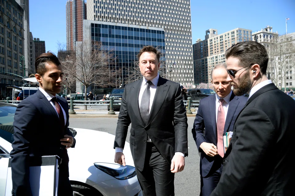 According to media reports on Saturday, Elon Musk (centre) fired top executives in an effort to avoid hefty severance payouts, while lining up other layoffs as soon as Saturday. 