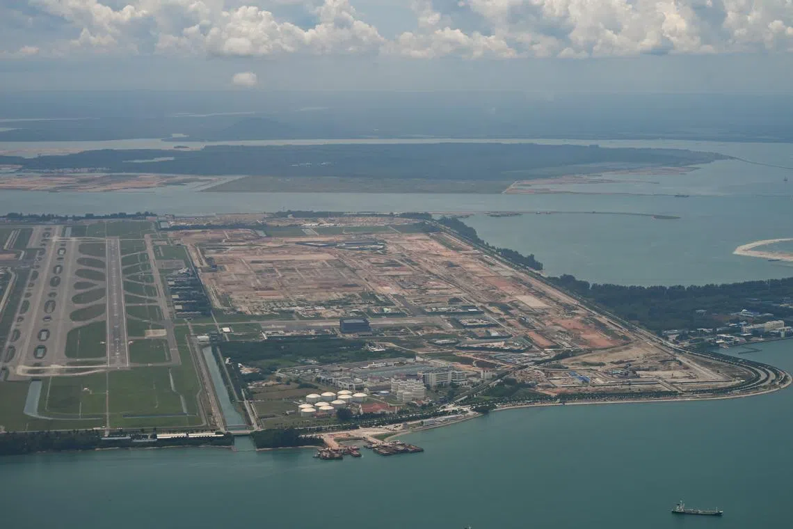 An aerial view of the construction area of Changi Airport Terminal 5. The proposed Changi East Urban District will occupy a 40 ha tract of land – about the size of 56 football fields.