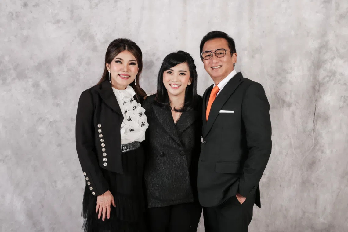 Melisa Tanoko (centre), president director of Sariguna Primatirta, Indonesia-listed bottled water company, pictured with her parents, Sanderawati Joesoef (left) and Hermanto Tanoko.