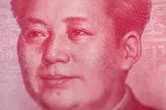 Aside from using yuan to counter a growth slowdown, another long-term agenda may impact China’s currency policy. 