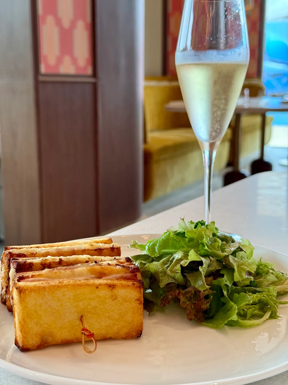 The croque monsieur is a warm, comforting buttery toast layered with ham and cheese, with a salad on the side.