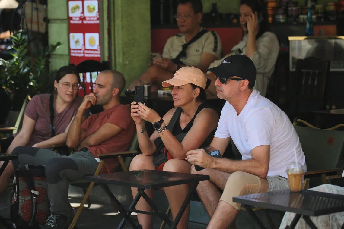 Tourists at a cafe in Hanoi. Vietnam, famous for its array of cheap and delicious food, is fast becoming a premium dining destination.