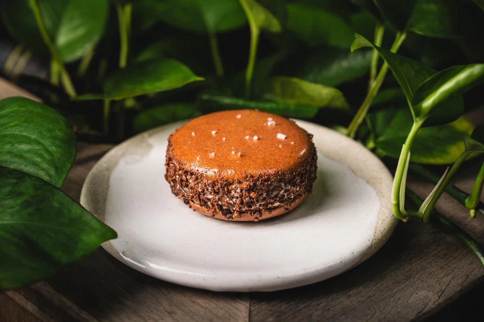 The valrhona chocolate macaron is sandwiched with fish eye ice cream.