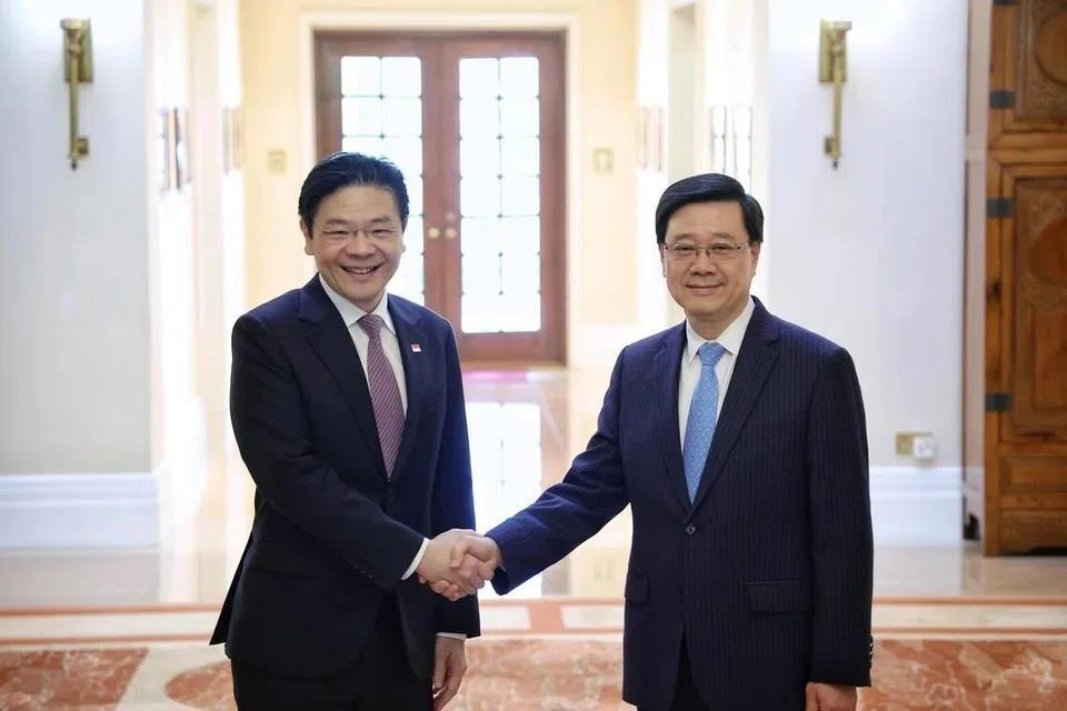 Prime Minister Lawrence Wong (left) meeting Hong Kong Chief Executive John Lee at the Government House in Hong Kong on Mar 27.