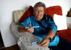 Kim Gradwell, who has type 2 diabetes, begins the Ozempic injection at her home in Dudley, North Tyneside, Britain, Oct 31, 2023. 