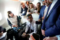 British Prime Minister Rishi Sunak speaks with political journalists on board a government plane as he heads to Washington, US, June 6, 2023.
