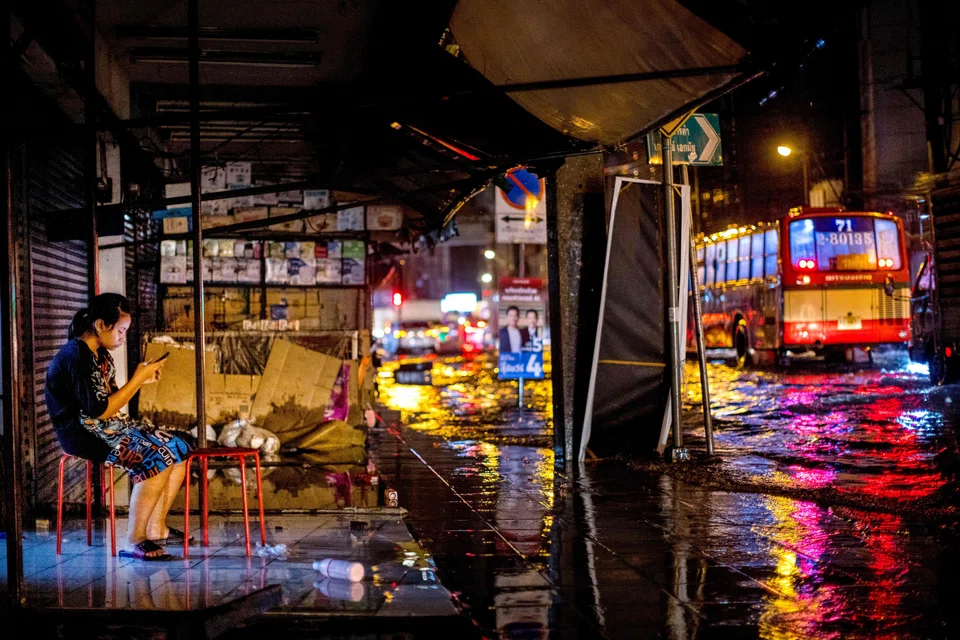 A flooded street in Bangkok. Sizable investments are needed to create sustainable infrastructure in Asian cities, which face the threat of climate change-related flooding.