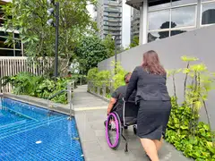 Ascott Orchard Singapore's pool has a ramp at the side and a grab bar.