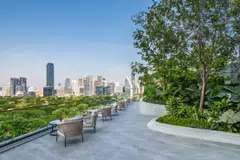 The outdoor terrace is a literal sky garden with its manicured landscaping  and cosy patio chairs.