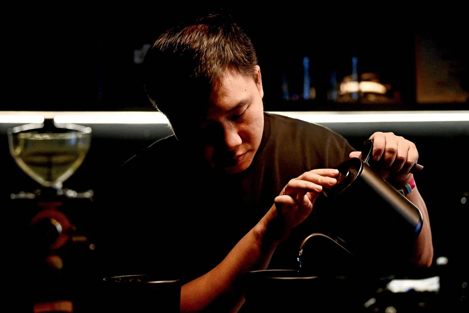  Coffee house owner Vu Dinh Tu, who ditched a lucrative career in finance, plans to open more shops and create a workforce that loves coffee as much as he does.