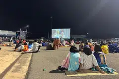 A movie screening at an evacuation centre at the Chang International Circuit in Buriram, Thailand, on Dec 10.