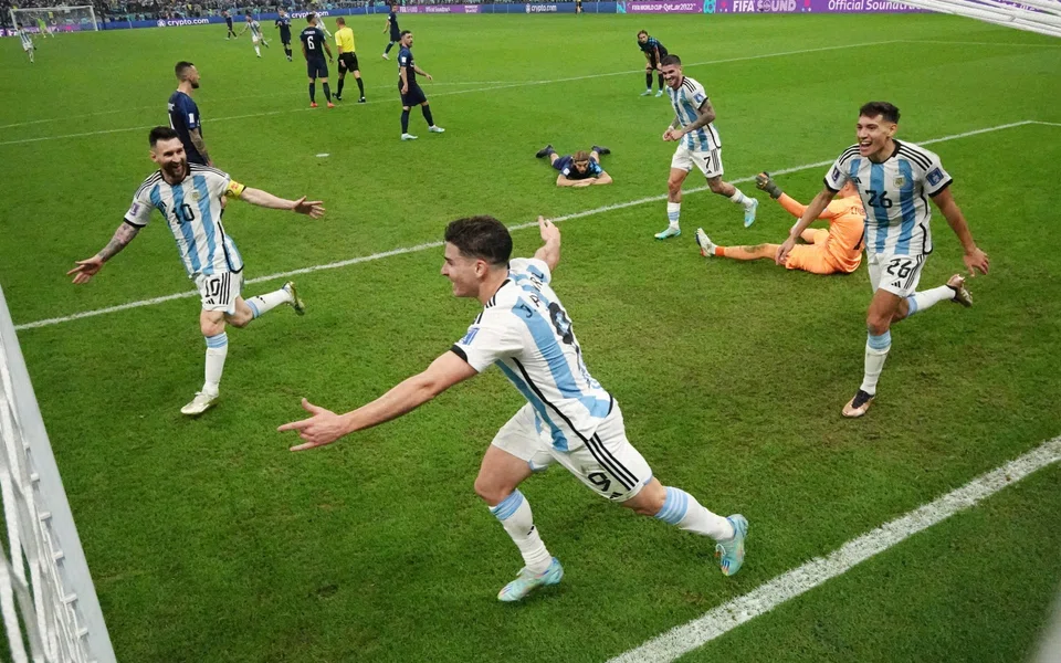 Argentina's Julian Alvarez celebrates scoring their second goal with Lionel Messi, Rodrigo De Paul and Nahuel Molina as Croatia's Dominik Livakovic and teammates look dejected, Lusail Stadium, Lusail, Qatar, Dec 13, 2022